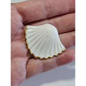Direction One white and gold tone shell pendant